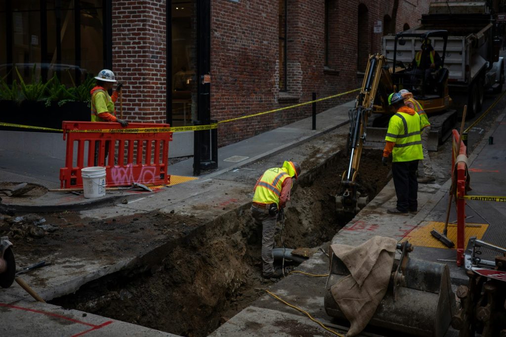 Construction workers in a trench