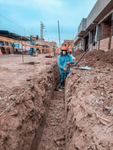 Person working in deep trench